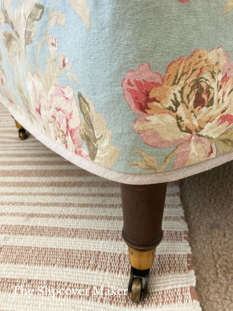 Linen flange hem detail on floral chair slipcover.