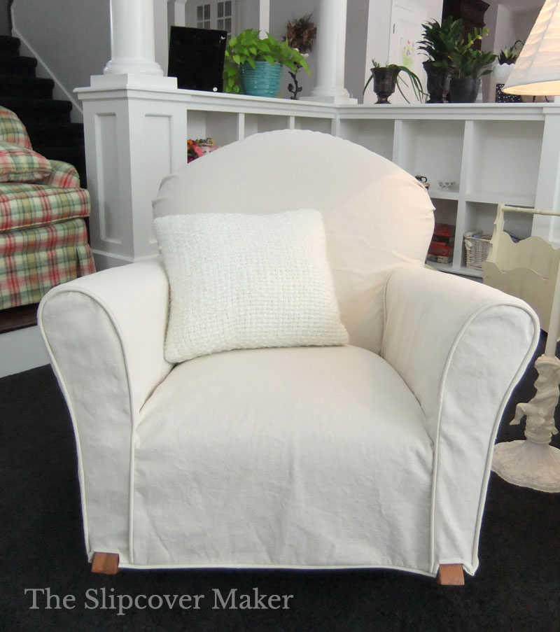 Small rocking chair with natural denim slipcover.