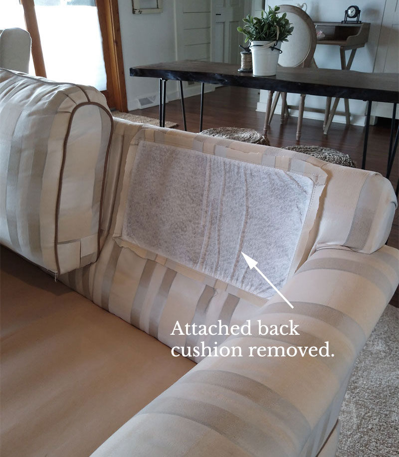 Couch with outlet attached back cushions