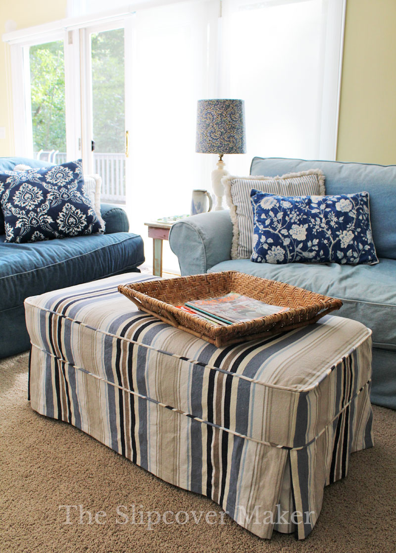 Striped canvas ottoman slipcover.