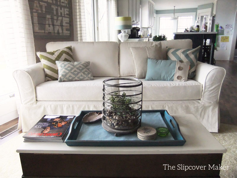 Boxy sofa with natural canvas slipcover.