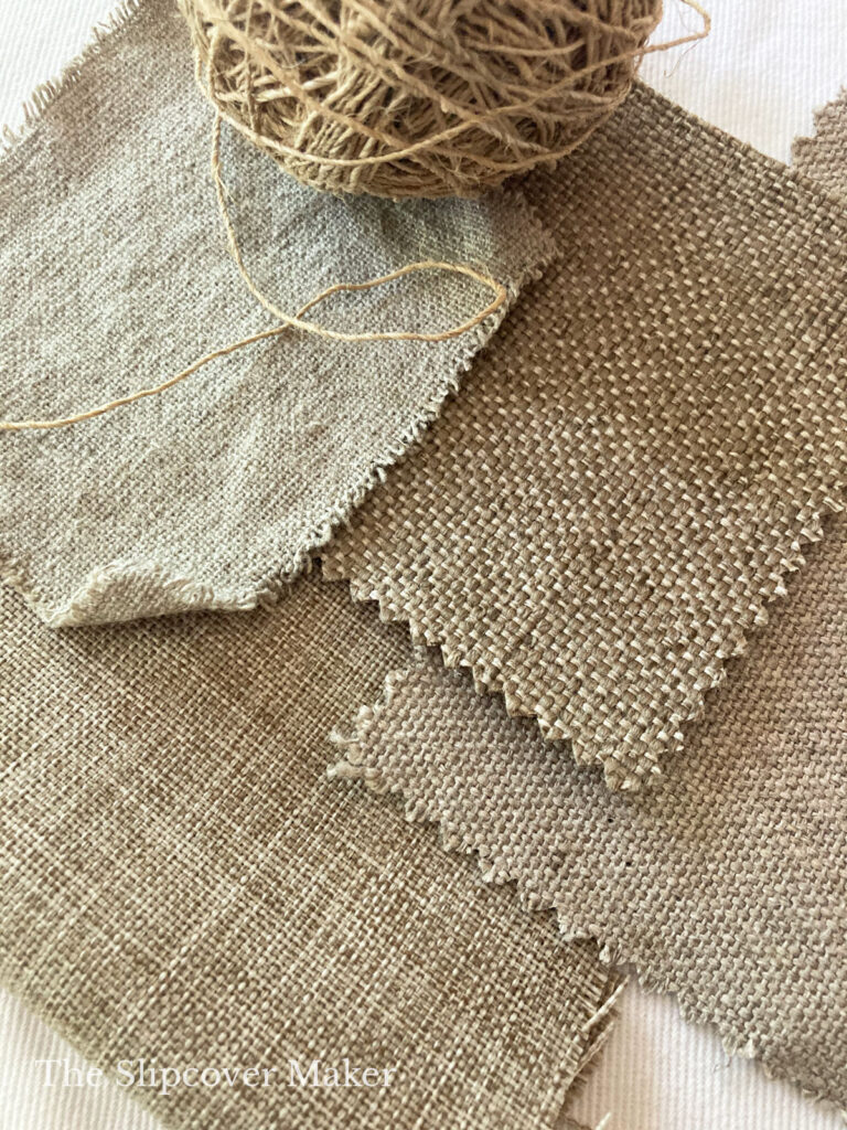 Burlap-like fabric swatches on table.