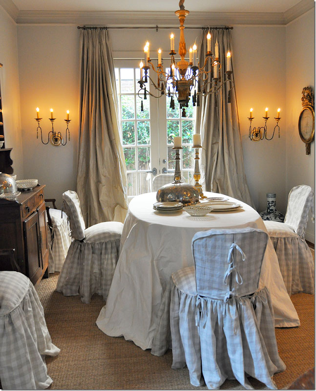 Dining chair slipcovers with gathered skirts.