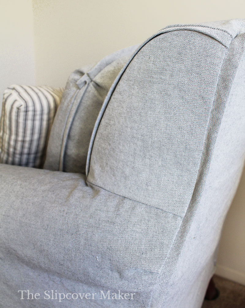 Grey canvas chair slipcover side panel.