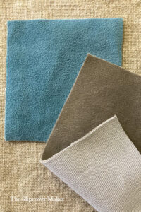 Aqua and beige velvet fabric swatches.