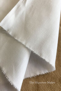 White polyester and cotton slipcover lining fabric.