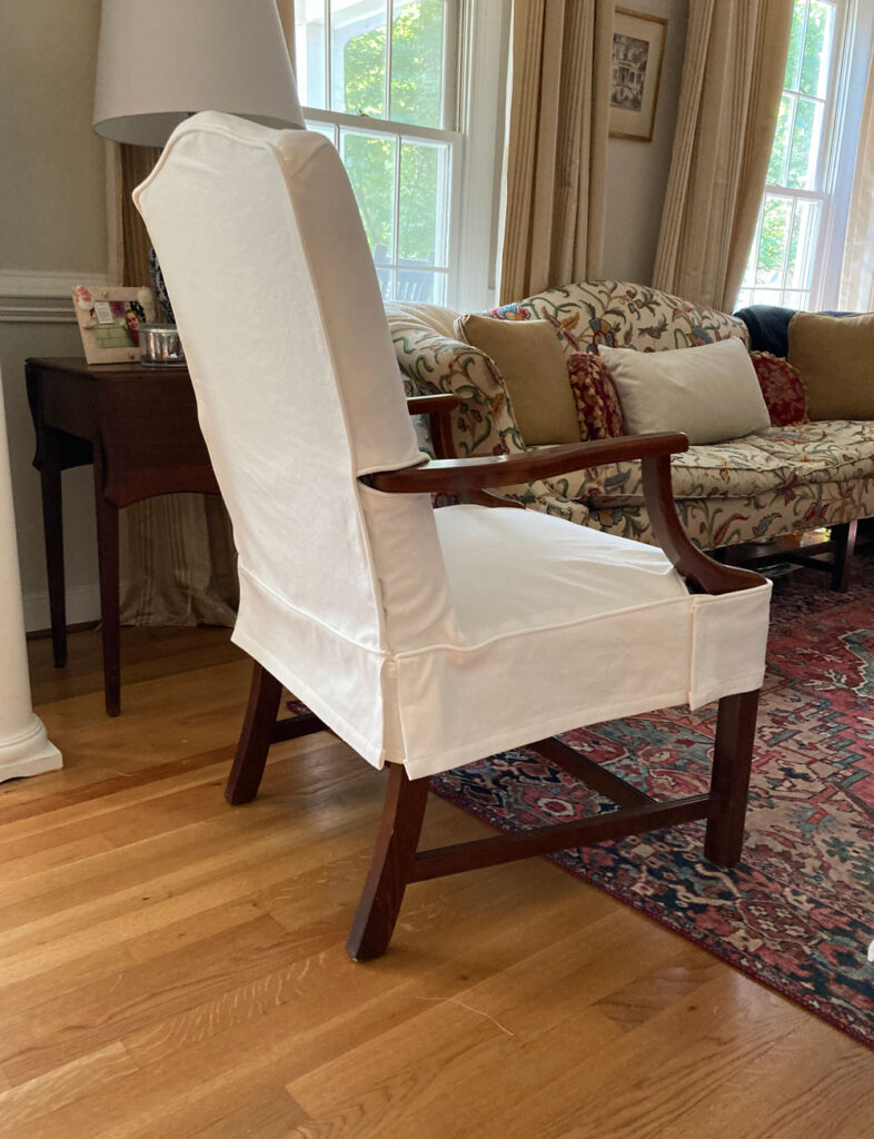 White denim side chair with slipcover.