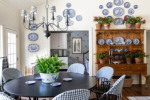 Blue check slipcover toppers on dining chairs.