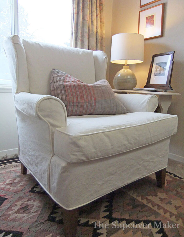Cream canvas chair in bedroom.
