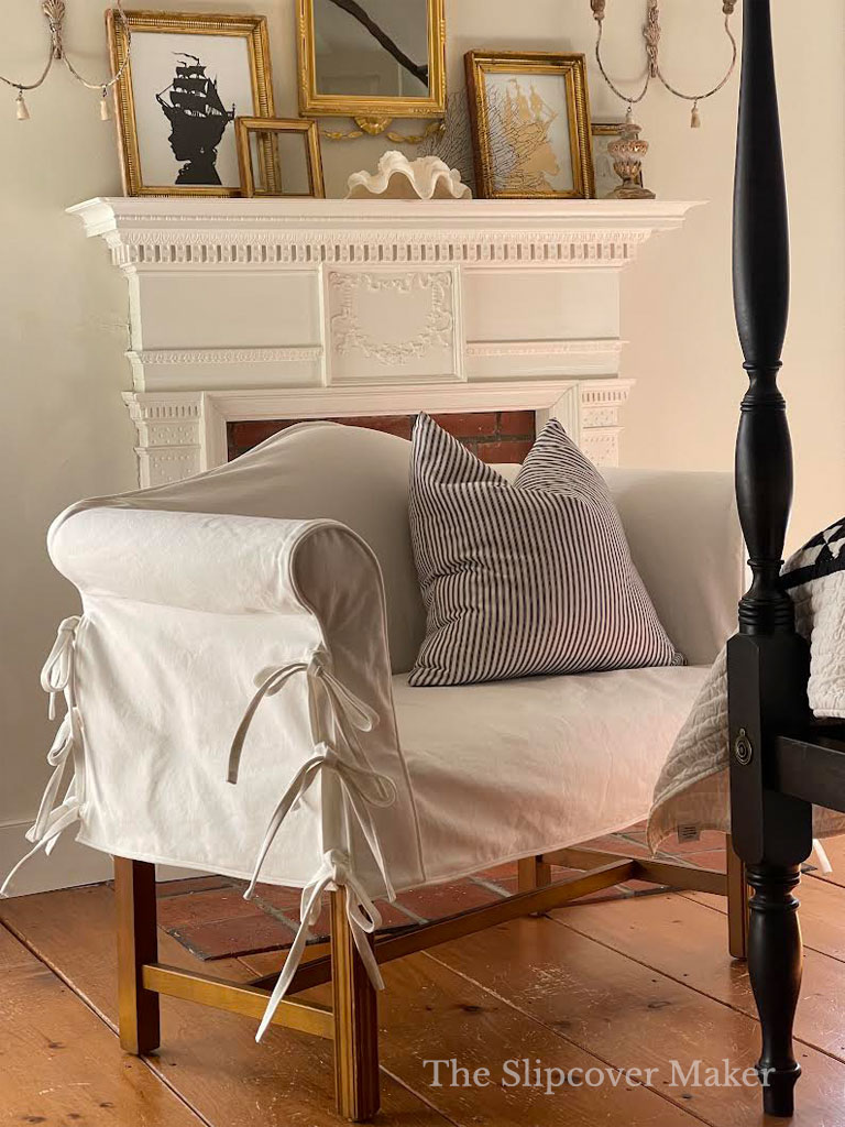 White denim settee slipcover in bedroom.