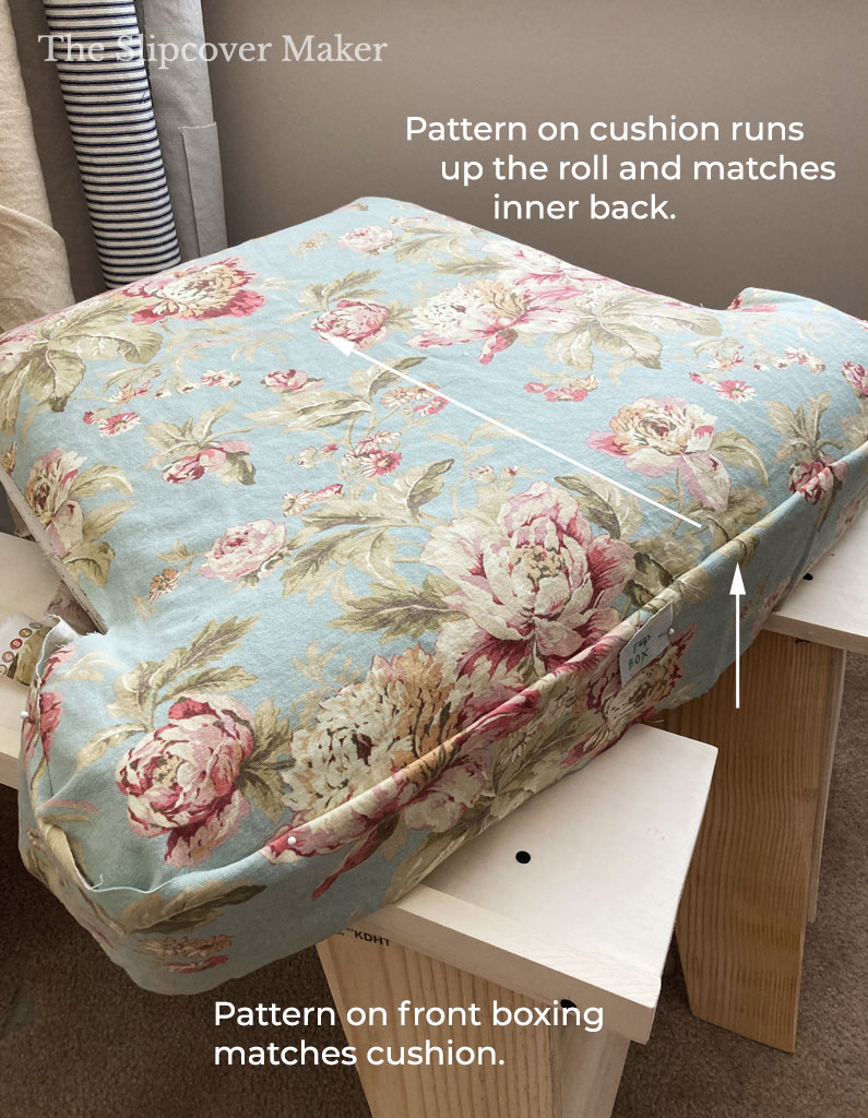 Chair seat cushion with floral cover.