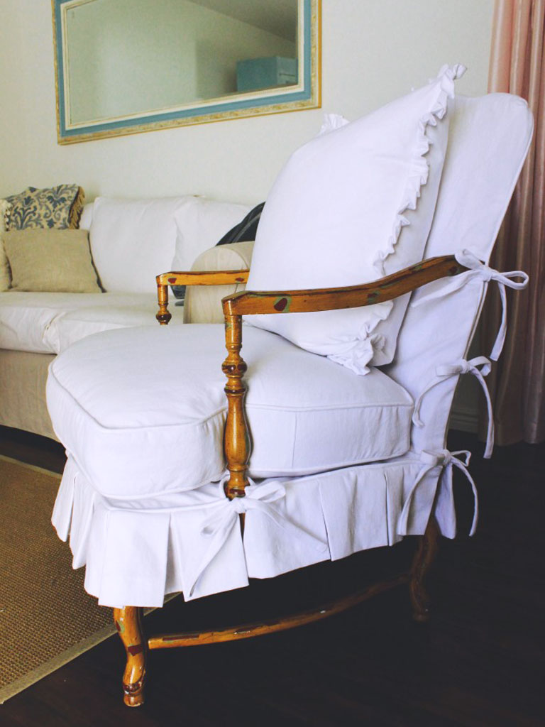 French chair with white slipcover and ties.