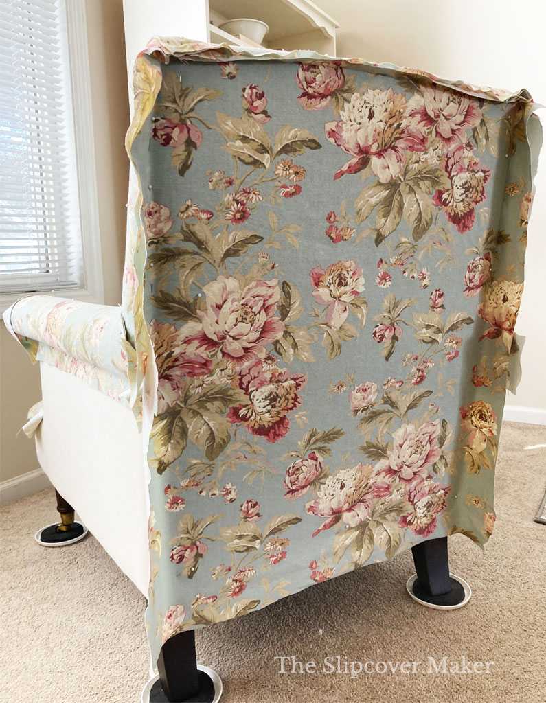 Big floral fabric on chair back.