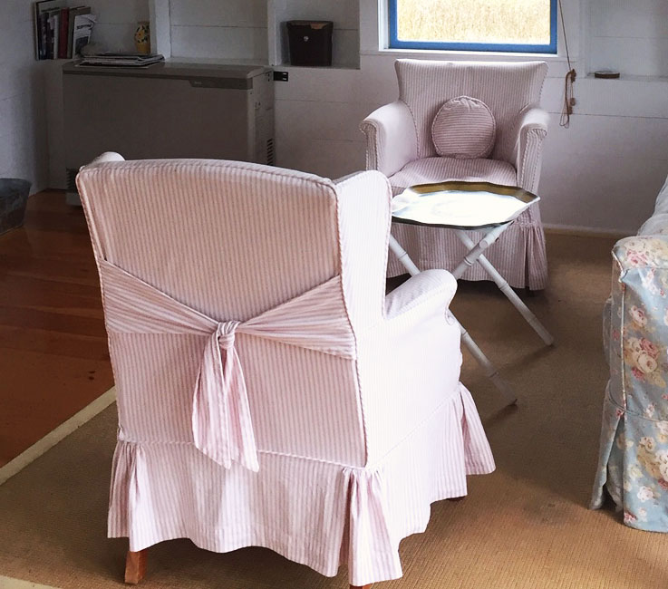 Pink ticking stripe chair slipcover with back tie.