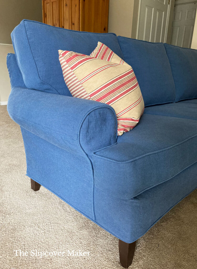 Blue canvas slipcover for rolled arm sofa.