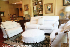 Vintage sofa and chairs slipcovered in linen.