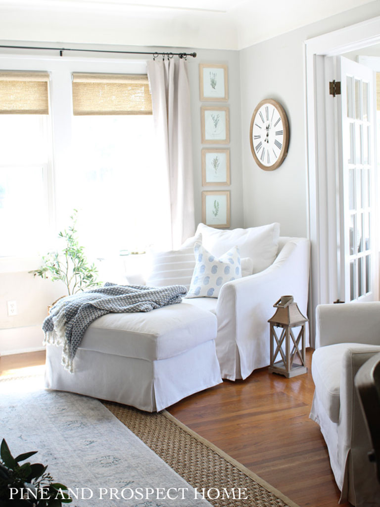 Simple white slipcover chair and ottoman.