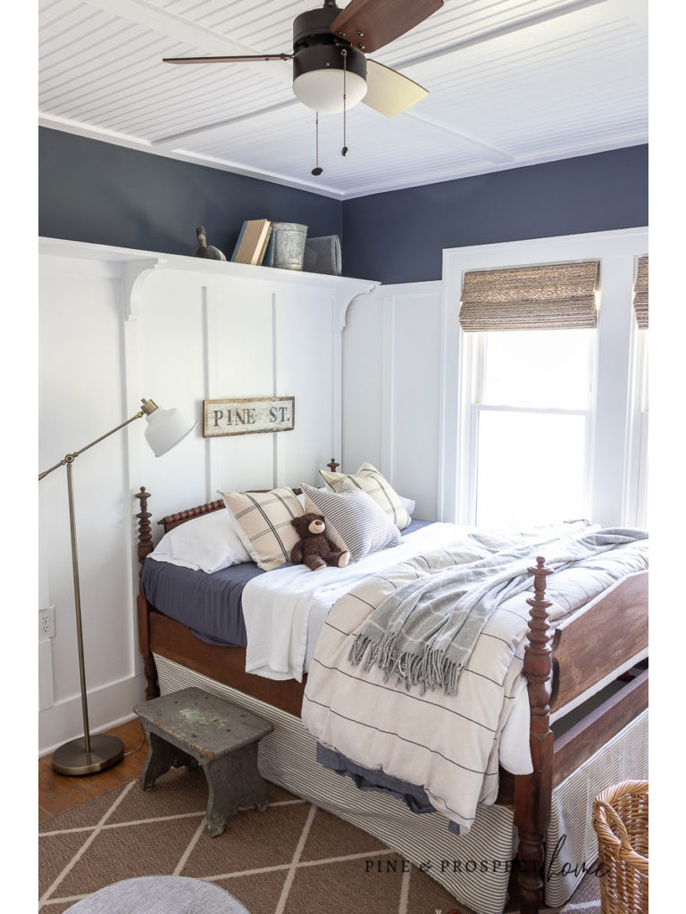 Blue and white stripe bed skirt for child's bed.