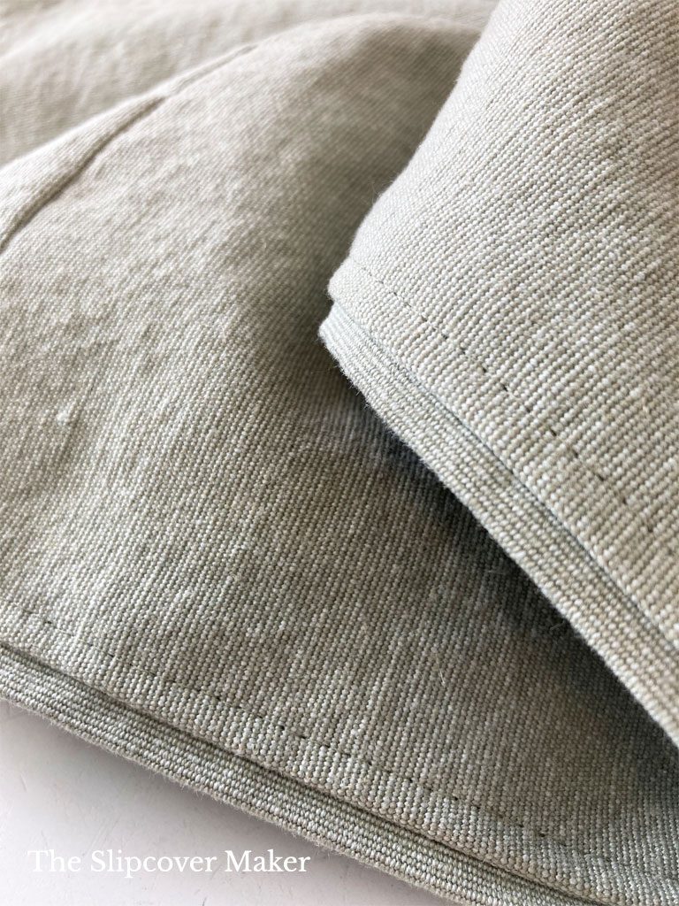 Slipcover with flange hem edge.