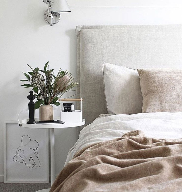 Natural linen slipcover on bed headboard.