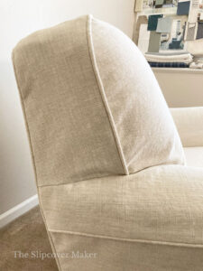Cotton linen slipcover on chair, side view.
