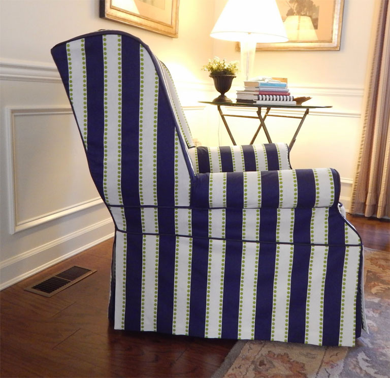 Bold navy blue stripe slipcover on a wingback chair.