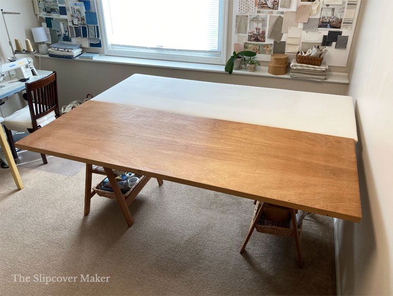 Slipcover work table made with hollow core door and pressing board.