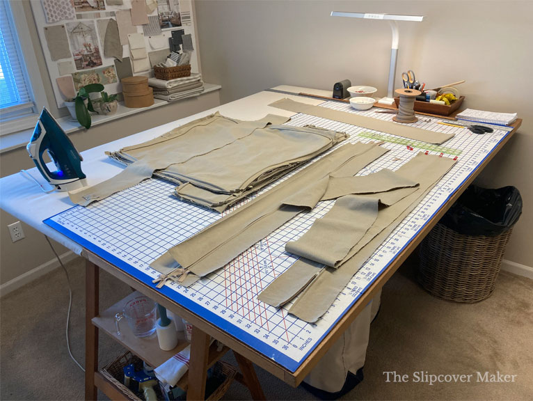 Slipcover work table for cutting and pressing.