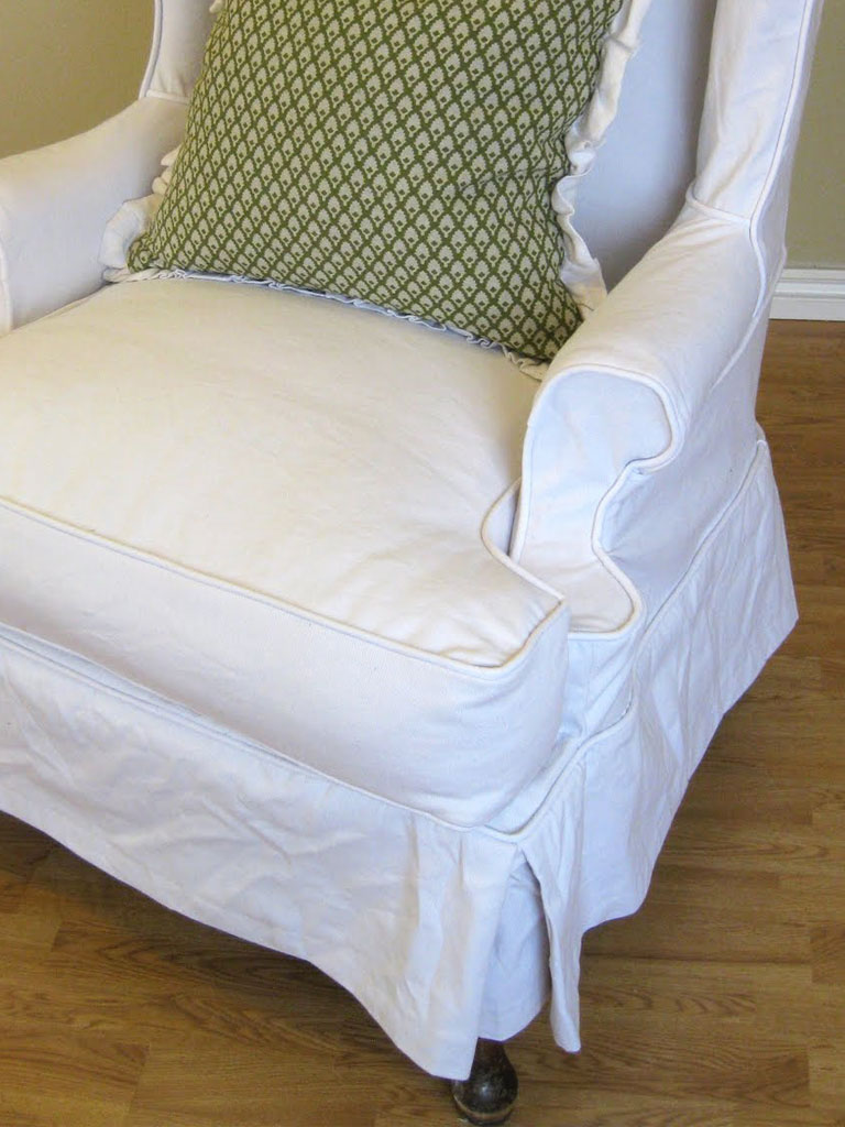 White denim slipcovered wingback chair.