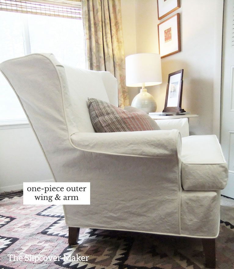 Wingback chair with natural canvas slipcover.