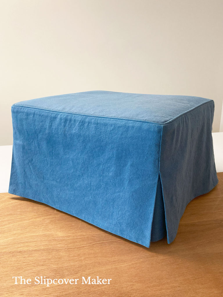 Blue canvas slipcover for pillow top ottoman.