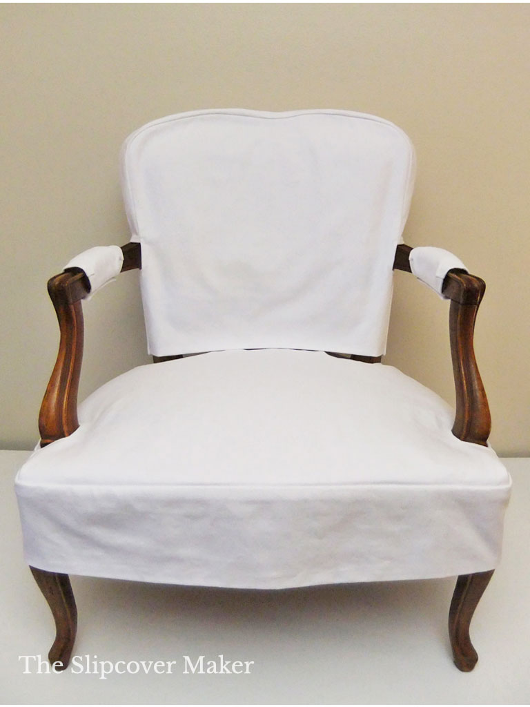 Old French chair with white denim slipcover.