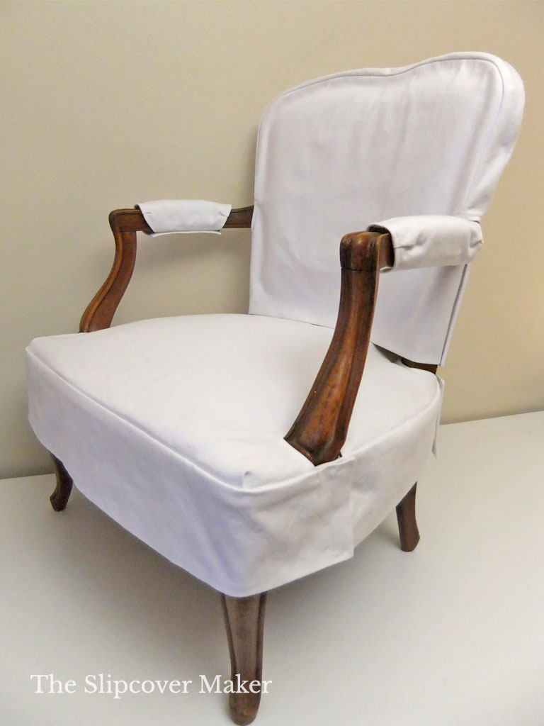 Simple white slipcover on antique French chair.
