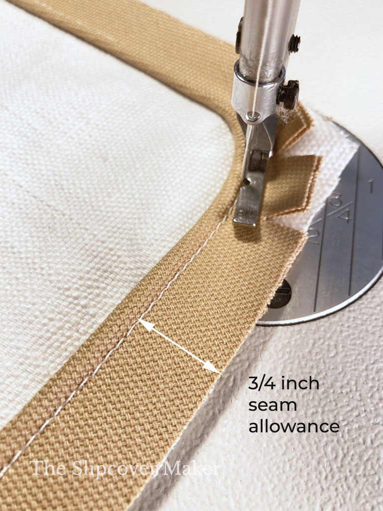 Tan welt cord stitched to pillow fabric.