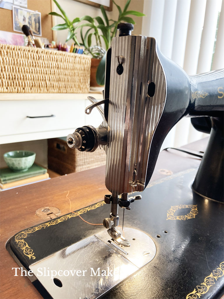 Old Singer sewing machine needle and nose.