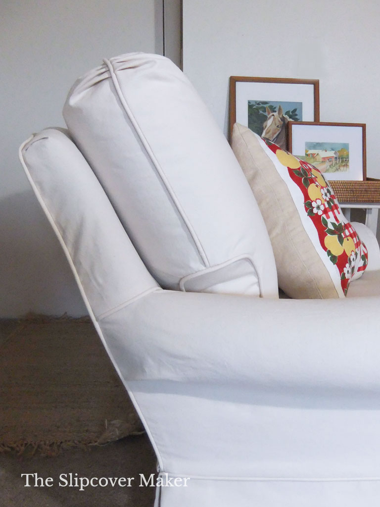 White canvas slipcover on armchair.