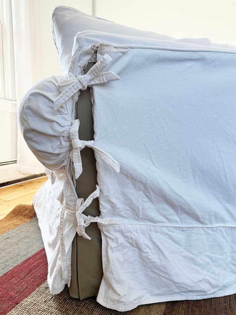 A sofa with a tie-on slipcover.