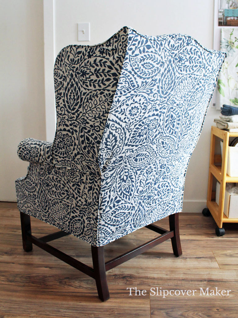 Back of blue floral slipcover on wingback.