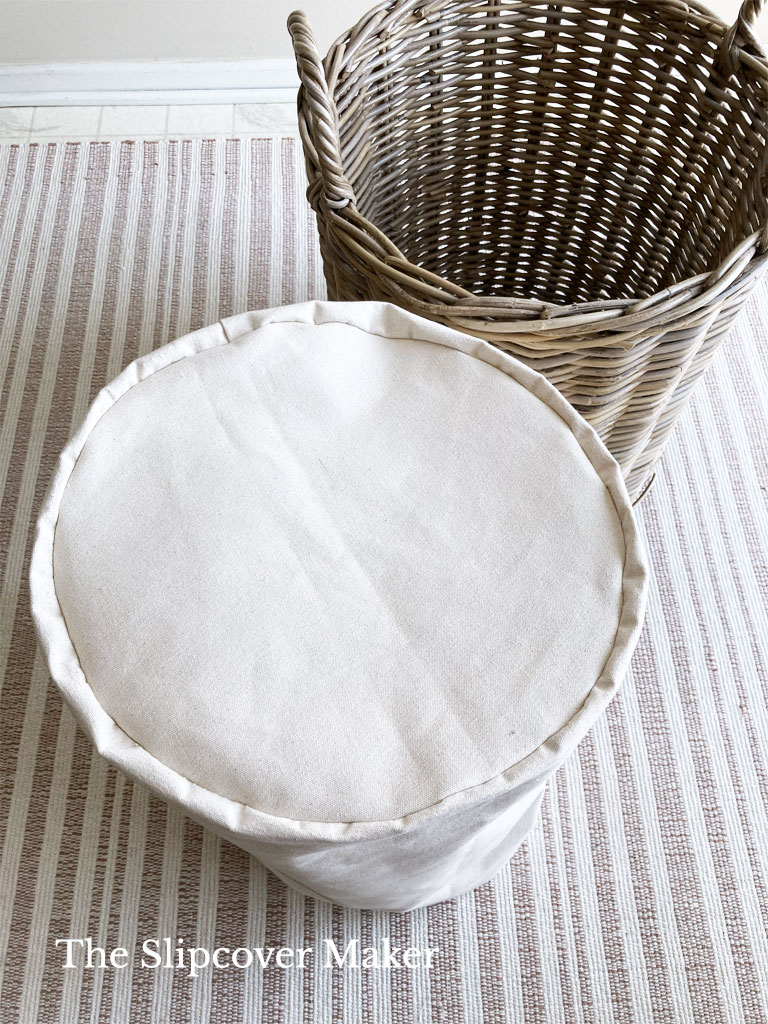 Round bottom of canvas basket liner.