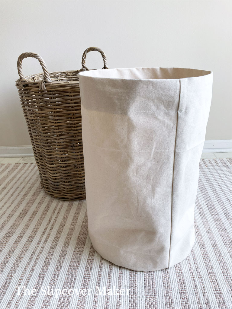 Cylinder shape canvas basket liner.