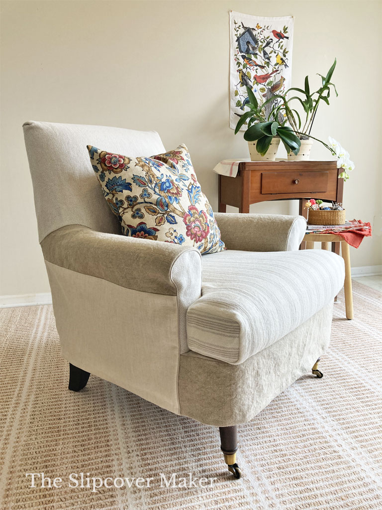 Armchair with slipcover made from five neutral fabrics.