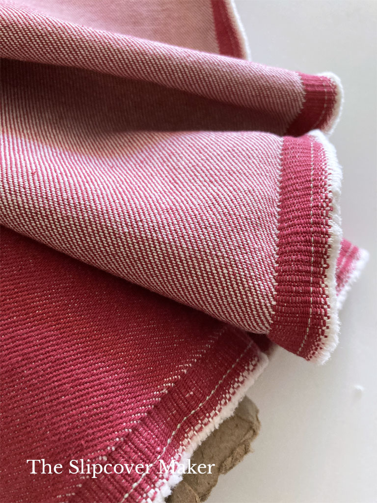 Red yarn-dyed denim on a roll.