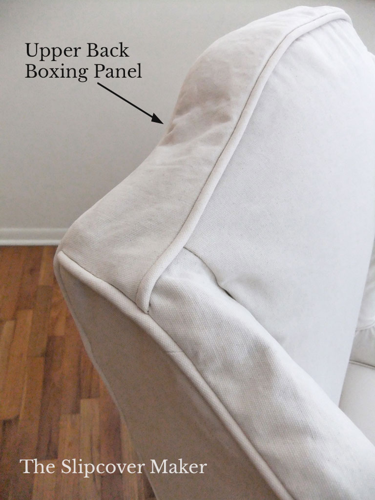 Boxing panel on top of wingback slipcover.