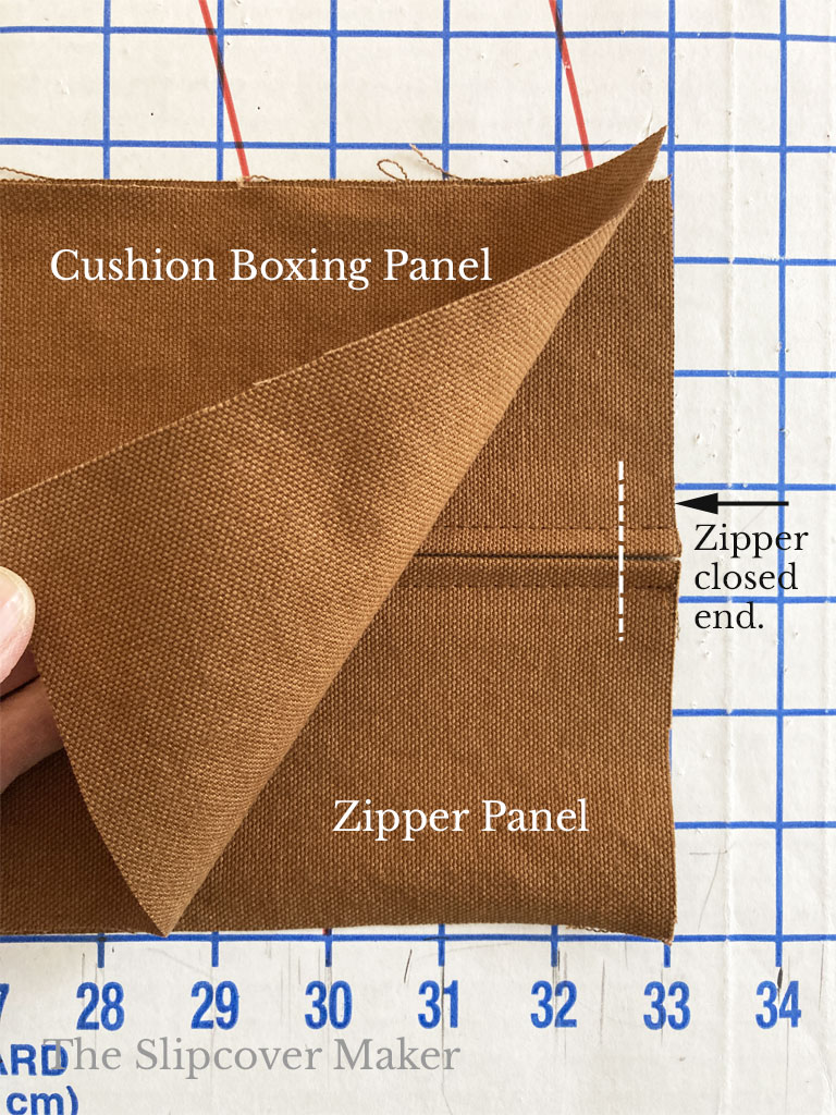 Attached zipper panelt to slipcover boxing.
