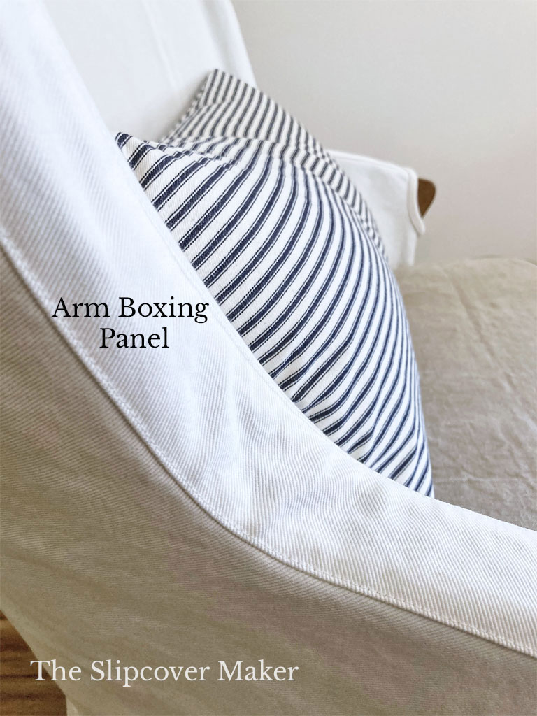 Narrow boxing panel covers exposed wood arms.
