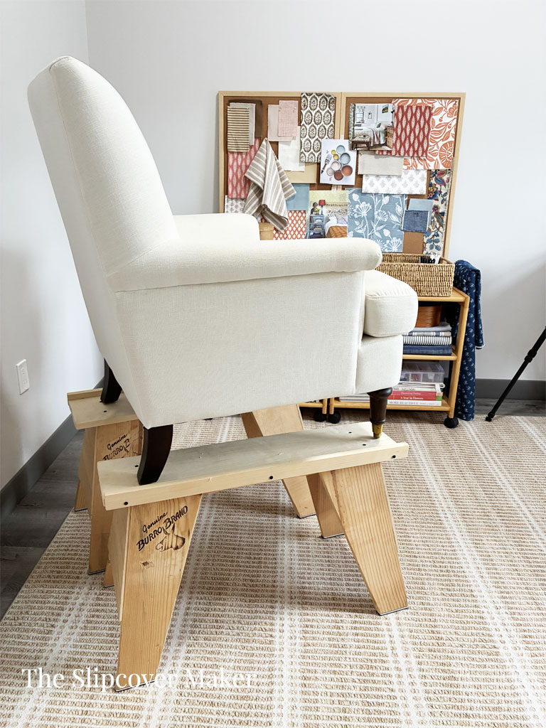 Chair on risers in slipcover workroom.