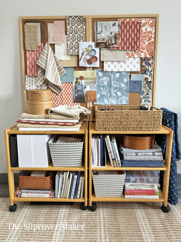 Storage and pin boards in slipcover workroom.